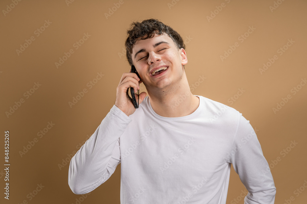 teenage boy caucasian man use mobile phone make a call talk studio teenage boy caucasian man use mobile phone make a call talk studio