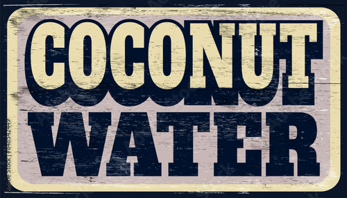 Aged and worn coconut water sign on wood