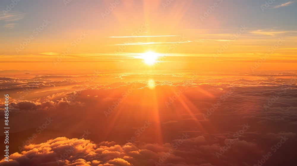 A breathtaking view of the sun setting above a sea of clouds, casting a warm golden light across the landscape A breathtaking view of the sun setting above a sea of clouds, casting a warm golden light across the landscape