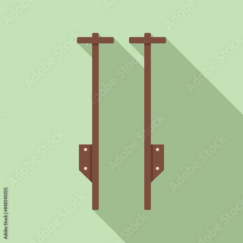 Two jumping stilts standing upright with foot supports and handles, fun recreational activity and outdoor game