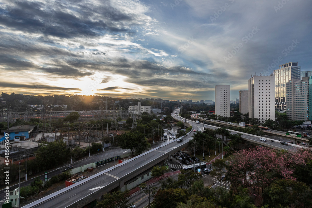 Fototapeta premium View of sunset in Sao Paulo city, Brazil. Beggining the night in metropolis, Skyline, cars and traffic on the road