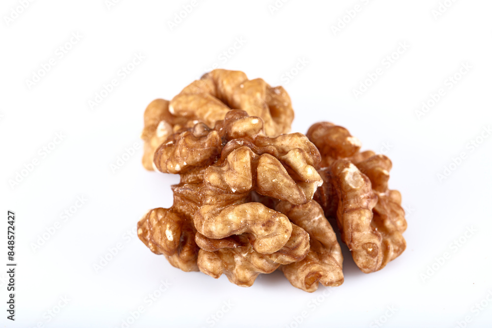 Walnut kernel, Closeup of big shelled walnuts pile. Top view of bunch of nutrient fresh walnuts without shell isolated on white background. Walnut kernel, Closeup of big shelled walnuts pile. Top view of bunch of nutrient fresh walnuts without shell isolated on white background.
