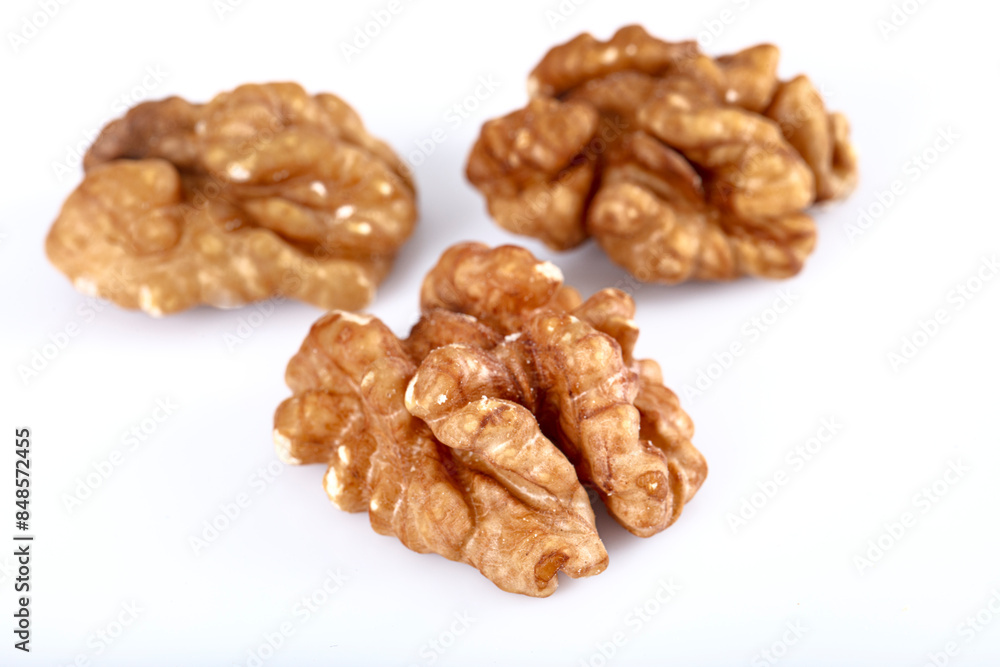 Walnut kernel, Closeup of big shelled walnuts pile. Top view of bunch of nutrient fresh walnuts without shell isolated on white background. Walnut kernel, Closeup of big shelled walnuts pile. Top view of bunch of nutrient fresh walnuts without shell isolated on white background.