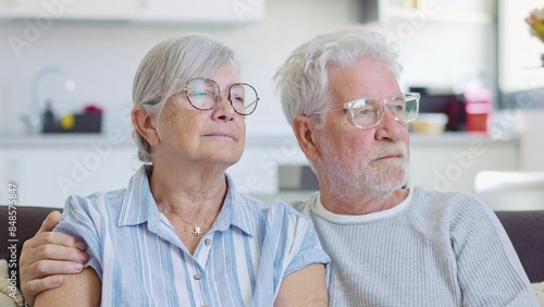 Wallpaper Mural Pensive elderly mature senior man in eyeglasses looking in distance out of window, thinking of personal problems. Old woman wife consoling and hugging sad husband, copy space
 Torontodigital.ca