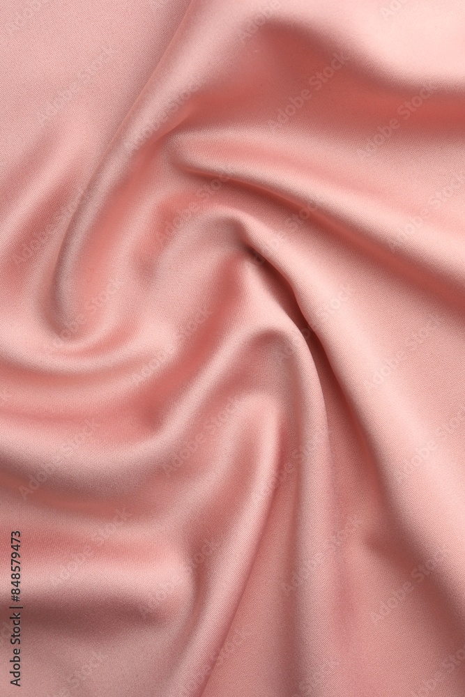 Fototapeta premium Crumpled pink silk fabric as background, top view