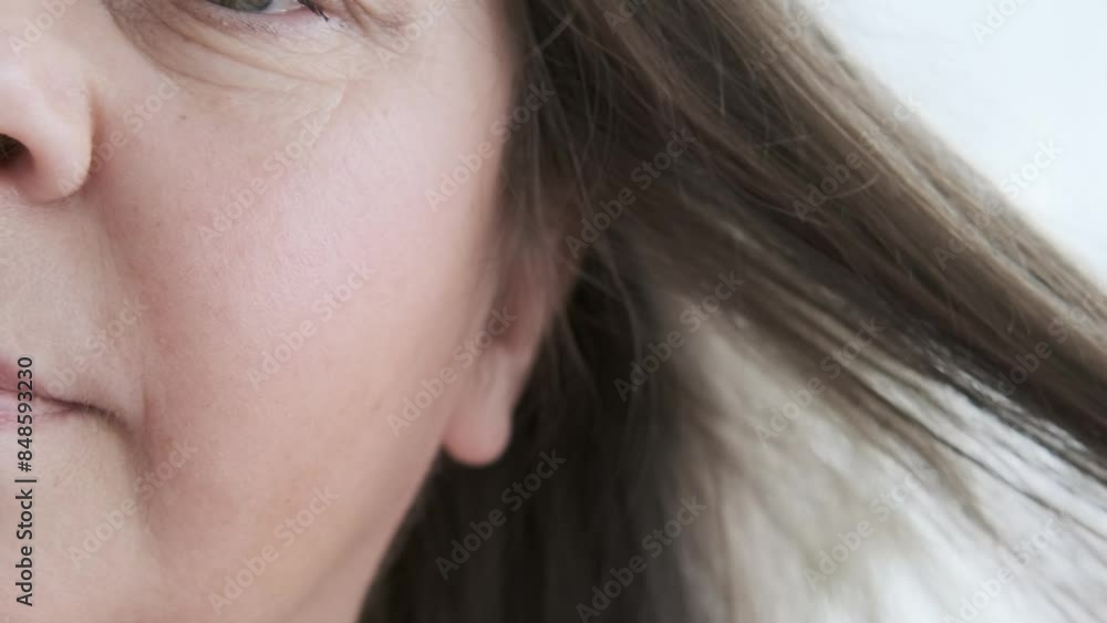 mature brunette woman examines long hair for signs aging, discovering gray hair, checkup, aging problems, concept female age, menopause, midlife crisis, hairloss problem, hormonal imbalance mature brunette woman examines long hair for signs aging, discovering gray hair, checkup, aging problems, concept female age, menopause, midlife crisis, hairloss problem, hormonal imbalance