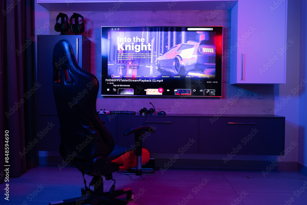 © Wavebreak Media - Gaming chair for video games in neon room with video streaming on screen, copy space