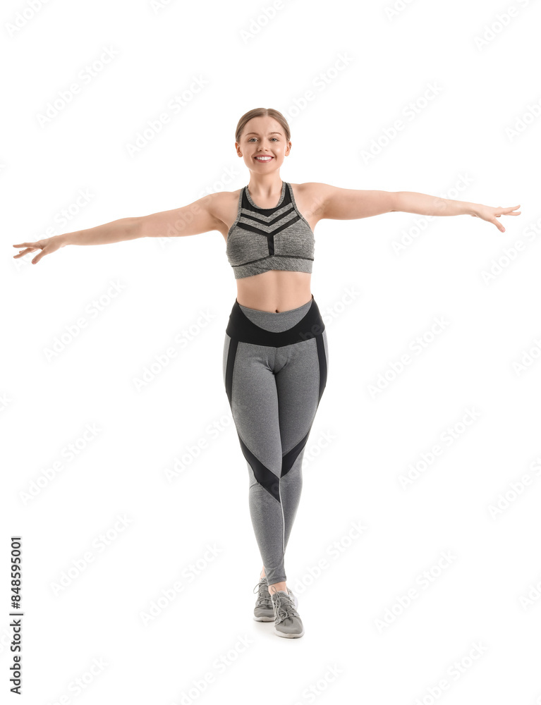 Sporty young woman balancing on white background Sporty young woman balancing on white background