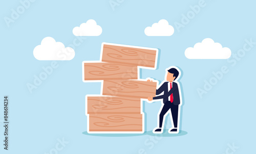 Investment risk comes from greedy choices; use careful, balanced strategies in uncertainty, concept of A businessman pulls a wooden block from a collapsing stack