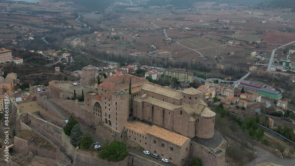Cardona Castle overlooking a historic town with surrounding countryside in an aerial view Cardona Castle overlooking a historic town with surrounding countryside in an aerial view