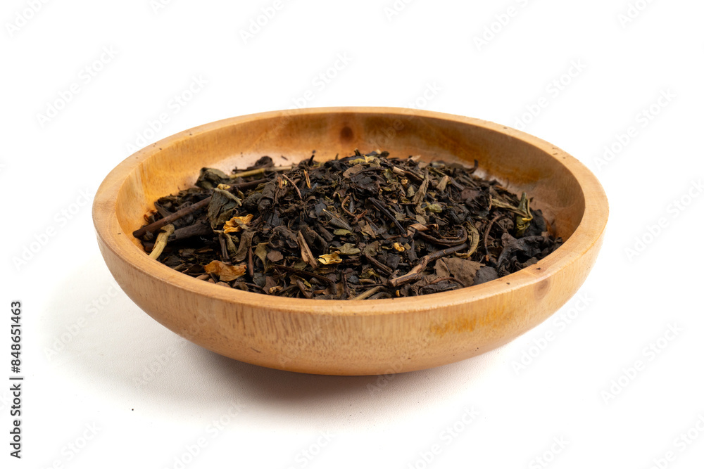 high angle shot of dried tea leaves in wooden bowl isolated white background high angle shot of dried tea leaves in wooden bowl isolated white background