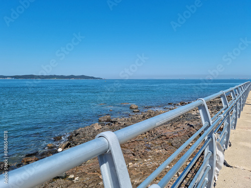This is a seascape with a guardrail. © binimin