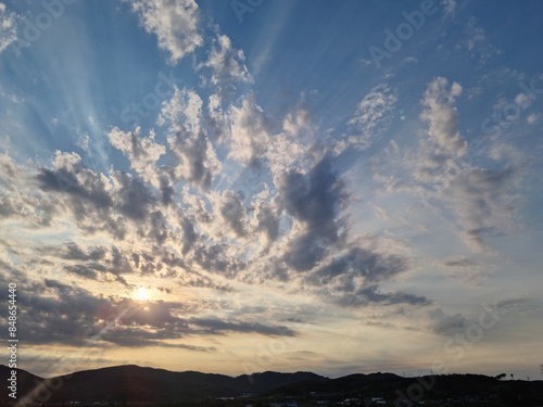 Dark mountain silhouette and sunset sky.