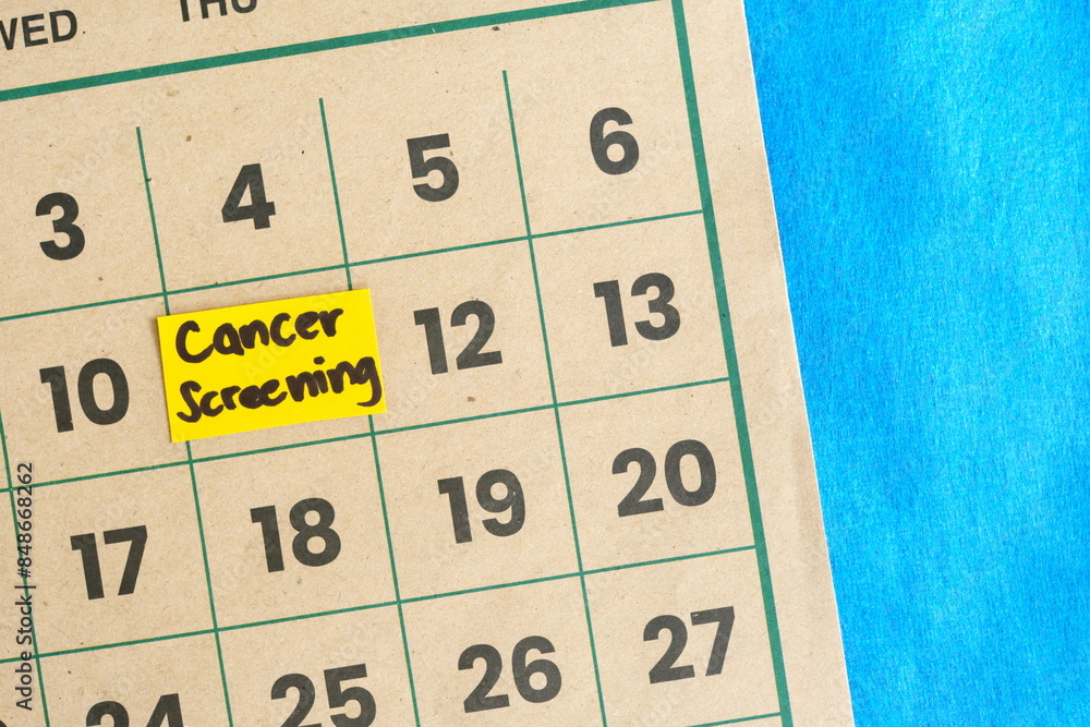 Cancer screening schedule concept. Written reminder note on calendar.