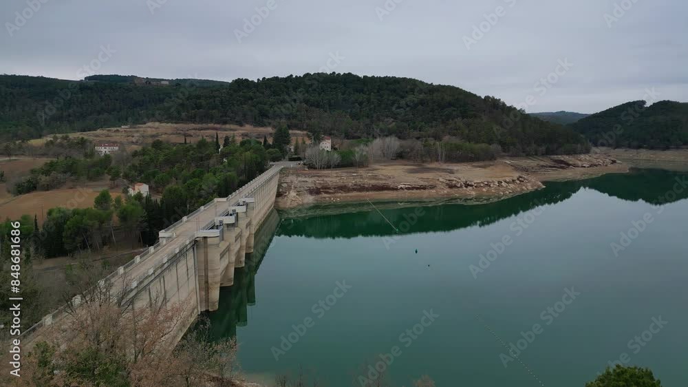 Calm view of San Ponce Reservoir surrounded by forested hills near Barcelona Calm view of San Ponce Reservoir surrounded by forested hills near Barcelona