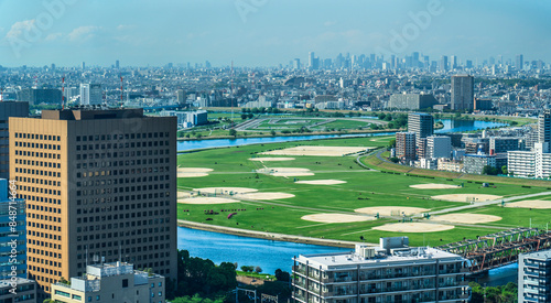 川崎から見た多摩川と東京方面の都市風景　俯瞰【神奈川県・川崎市】　
The Tama River and the cityscape of Tokyo seen from the observation deck of Kawasaki - Kanagawa, Japan photo