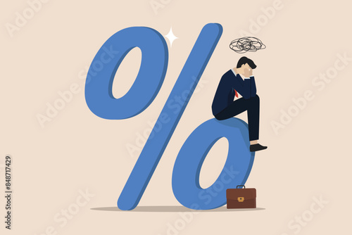 Debt burden risk from high interest rate, FED or federal reserved rate hike cause heavy loan, economic recession concept, confused businessman bearing the burden of large percentage interest rates.
