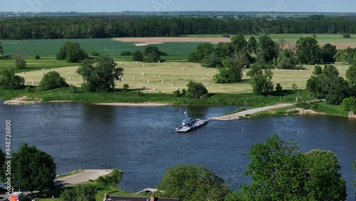 Ferry crossing the river elbe near barby saxony-anhalt - camera moving from left to right photo