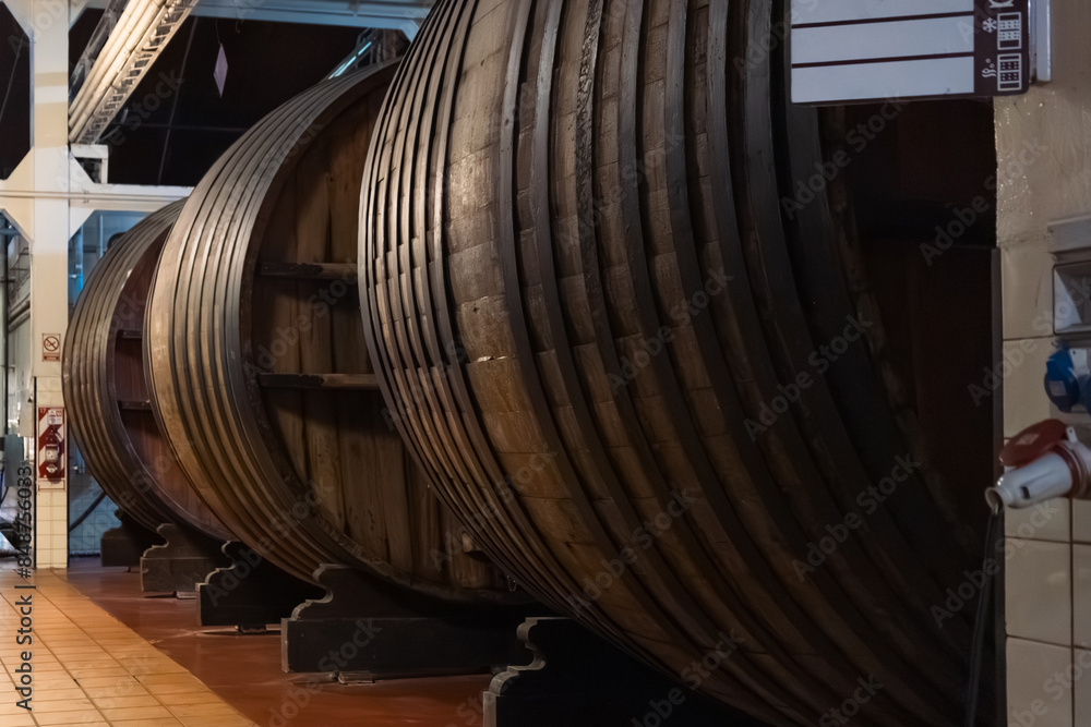 Wooden Barrels in a Winery Cellar Wooden Barrels in a Winery Cellar