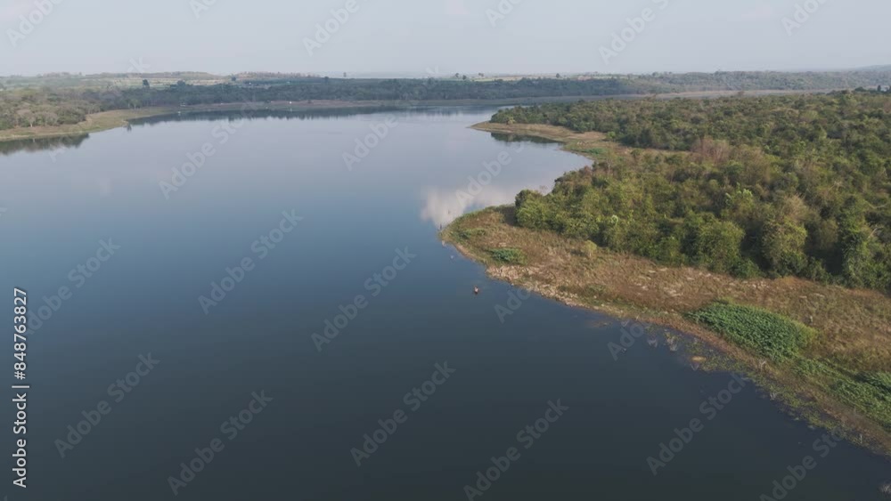 Drone shot aerial view scenic landscape of the boat sailing in big river Drone shot aerial view scenic landscape of the boat sailing in big river