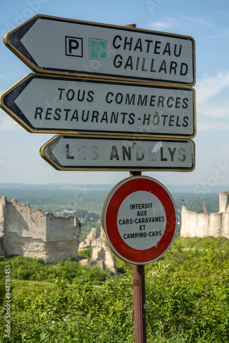 A Road Sign above the Backdrop of Castle Gaillard, near Andelys France in Normandy.