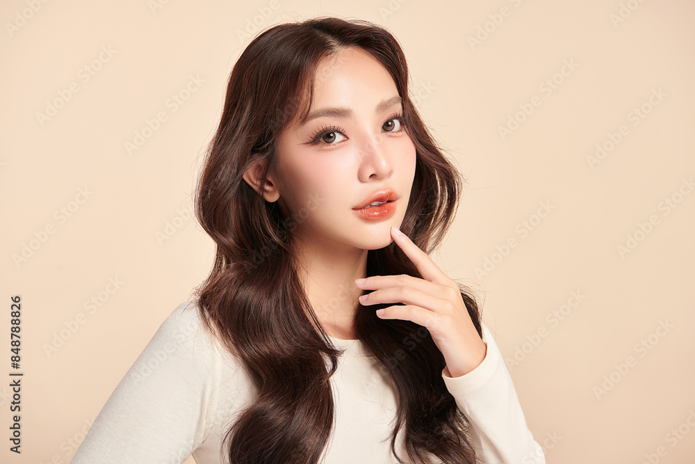 Beautiful young asian woman with clean fresh skin on beige background, Face care, Facial treatment, Cosmetology, beauty and spa, Asian women portrait.
