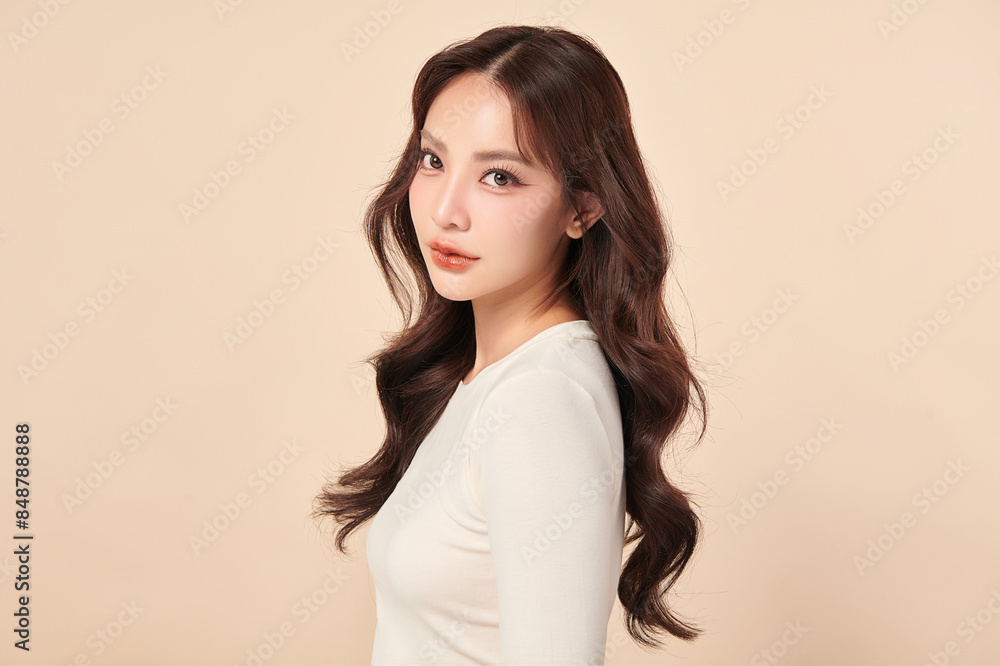 Obraz premium Beautiful young asian woman with clean fresh skin on beige background, Face care, Facial treatment, Cosmetology, beauty and spa, Asian women portrait.