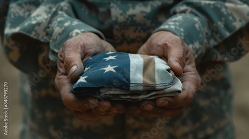 Soldier Holding American Flag. photo