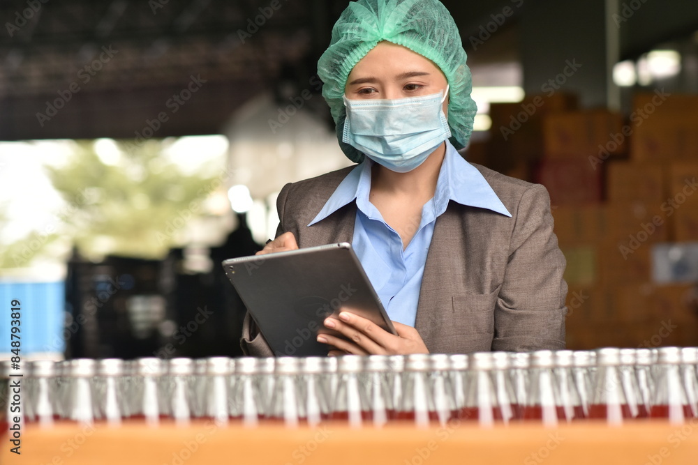 Fototapeta premium QC Quality Control manager Inspect products to guarantee quality before sending out to the consumer market.