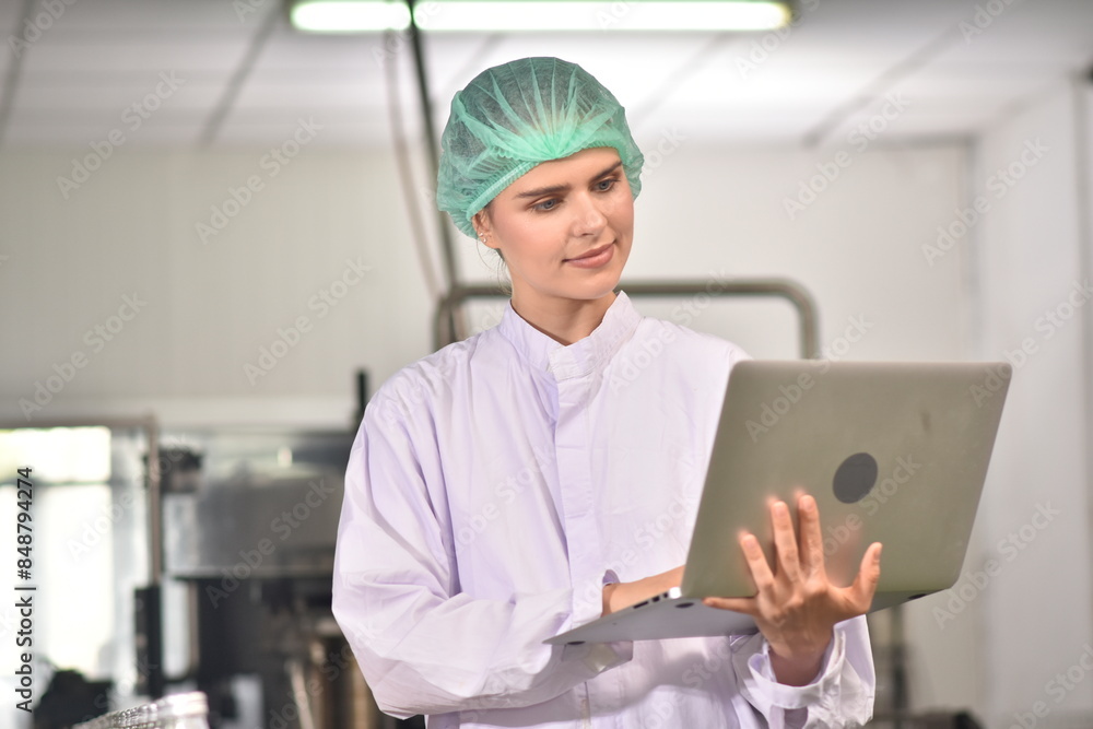QC manager inspecting the quality of a beverage product in the production process QC manager inspecting the quality of a beverage product in the production process