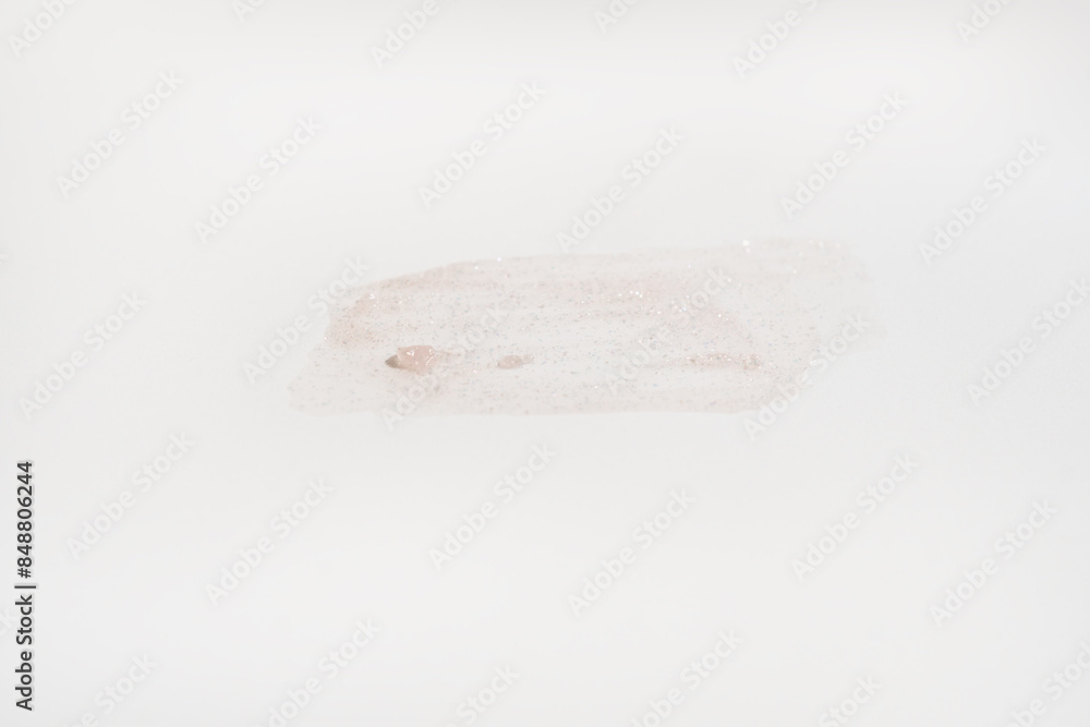 Obraz premium A smear of cream on a light background. Beauty concept.