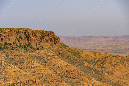 View of the mountain range near Medenine in Tunisia. View taken from the road leading to Ksar Ghilane, the oasis before the Sahara Desert. photo