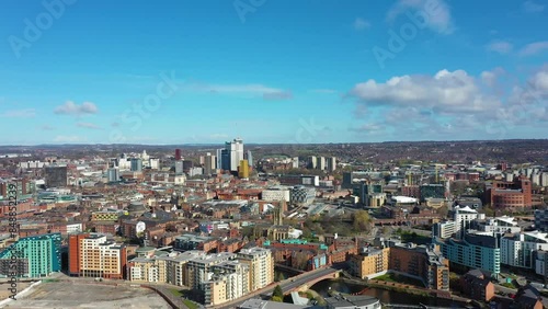 Wallpaper Mural Aerial footage of the city centre of Leeds in the UK showing the town centre on a sunny day with the drone flying over the city with white clouds in the sky Torontodigital.ca