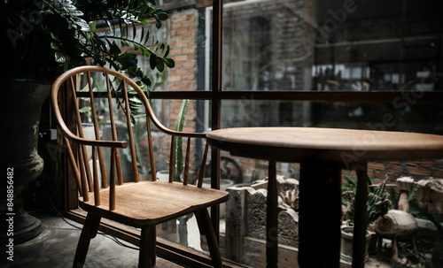 Comfortable seating on retro style by the window in living room, cafe, vintage background