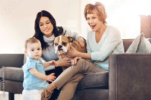 Mother, child and grandmother with dog on sofa in home for bonding, relax and happy for playing with pet. Family, parent and grandparent with baby in living room for security, trust and companion