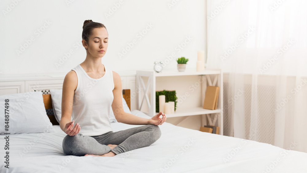 Morning Meditation. Woman Practising Yoga In The Morning, Sitting On Bed, Free Space Morning Meditation. Woman Practising Yoga In The Morning, Sitting On Bed, Free Space