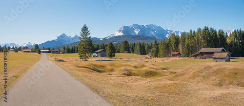 road and bike route through Buckelwiesen landscape, with alps view, near Mittenwald photo