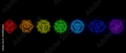 cyclic 3D rendering. chakras in esotericism. the glowing particles scatter in different directions photo