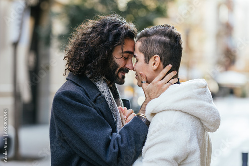 Loving embrace of a gay couple in the city