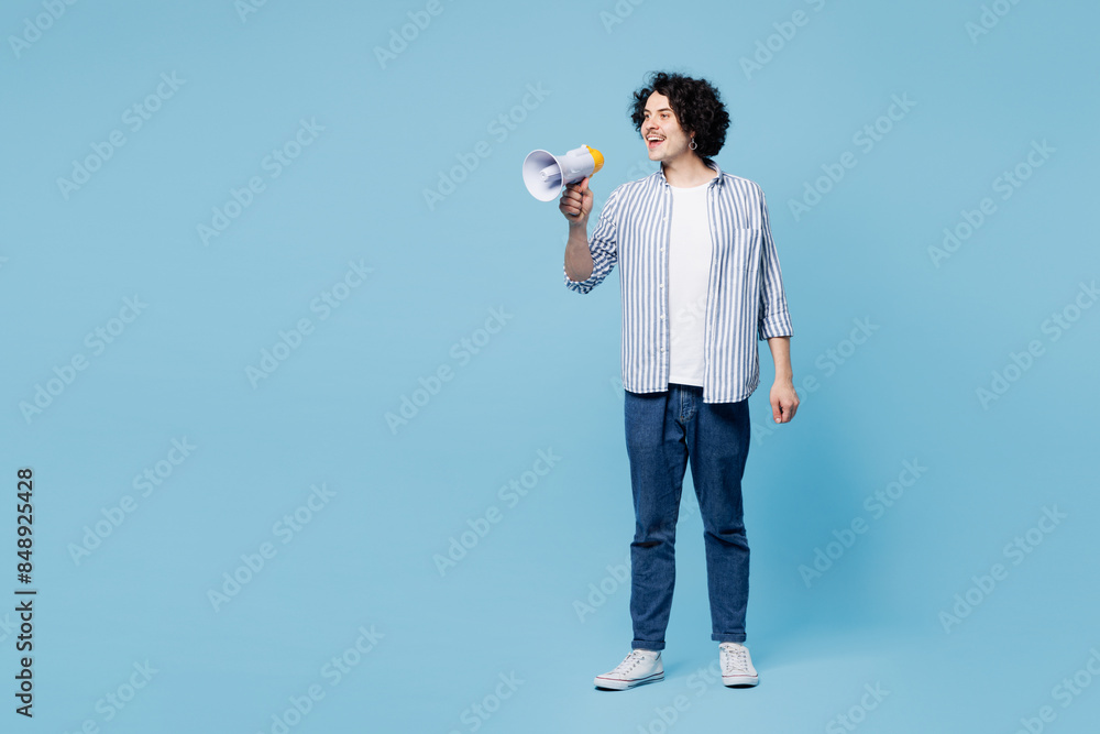 Full body young man he wear shirt white t-shirt casual clothes hold in hand megaphone scream announces discounts sale Hurry up isolated on plain pastel light blue cyan background. Lifestyle concept. Full body young man he wear shirt white t-shirt casual clothes hold in hand megaphone scream announces discounts sale Hurry up isolated on plain pastel light blue cyan background. Lifestyle concept.