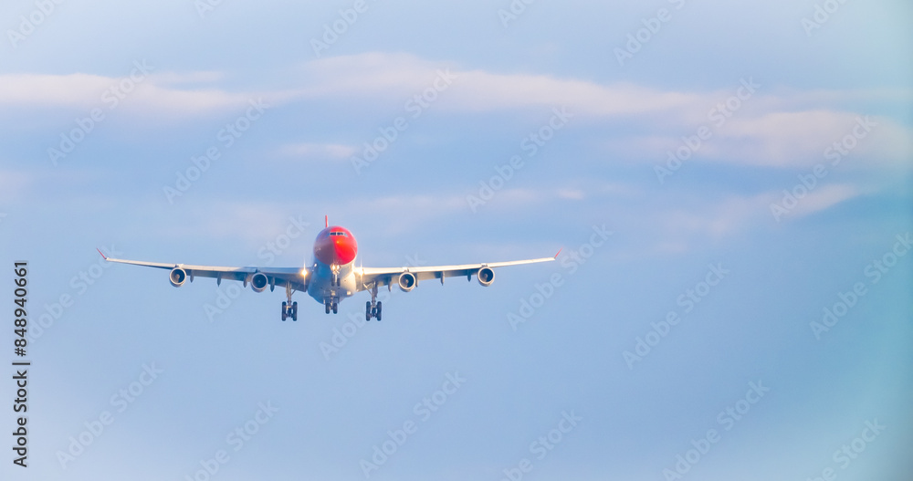 The plane lands over the sea at Phuket airport. A passenger plane lands on Mai Khao Beach, a popular tourist attraction. The plane lands over the sea at Phuket airport. A passenger plane lands on Mai Khao Beach, a popular tourist attraction.