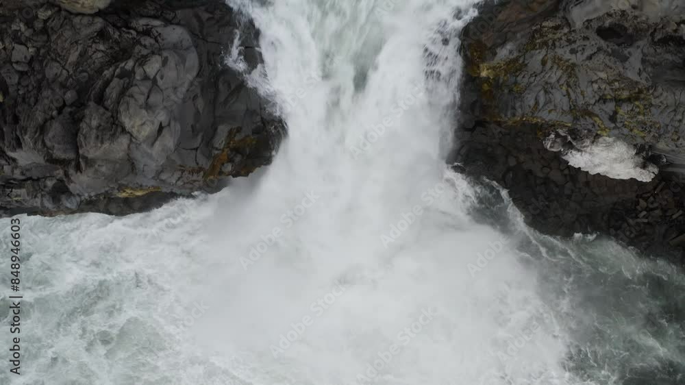 Powerful Cascading Water Flowing From Basalt Volcanic Rocks In Iceland. Aerial Shot Powerful Cascading Water Flowing From Basalt Volcanic Rocks In Iceland. Aerial Shot