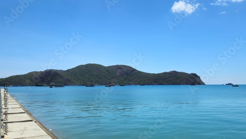 Beautiful blue ocean and mountain at Ben Dam port, Con Son island, Vietnam in the morning.