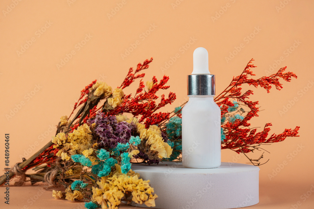 Cosmetic product in tube, bottle, lotion or serum and dried flowers on cream background. Cosmetic product in tube, bottle, lotion or serum and dried flowers on cream background.