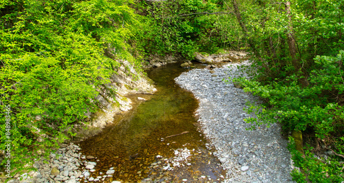 Mountain river with stones in summer
