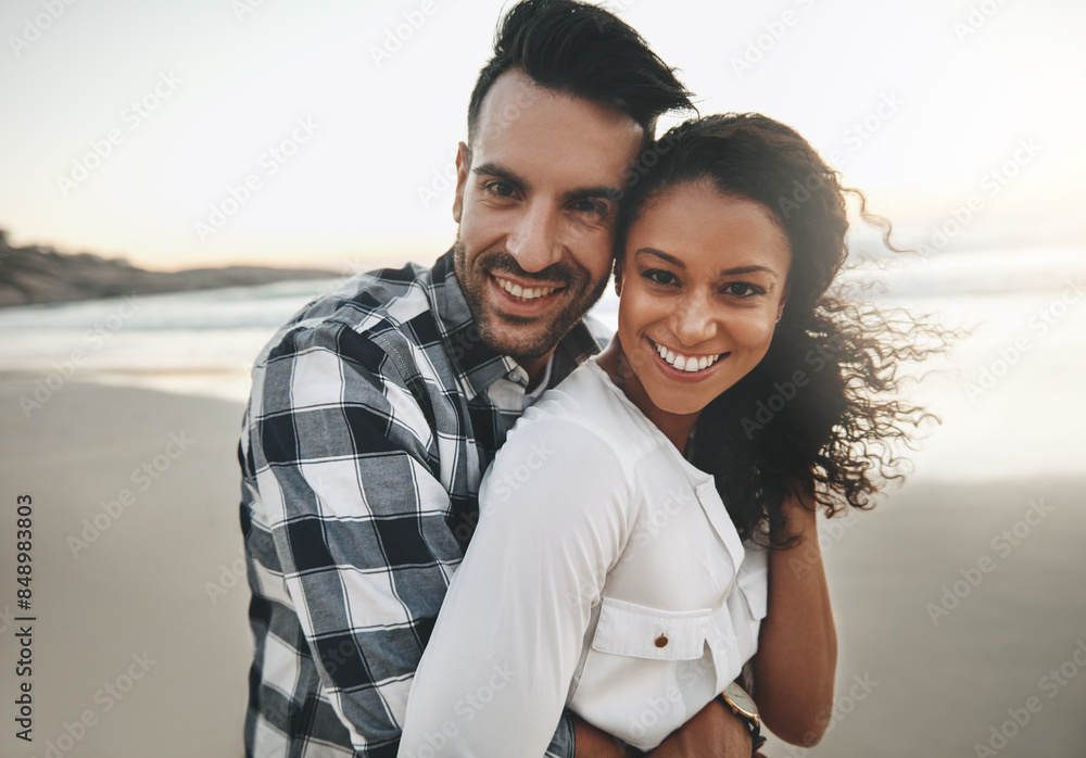Obraz premium Couple, hug and sunset at beach with portrait for care, love or connection for holiday in Brazil. Man, woman and embrace on vacation, date and outdoor in nature by ocean, excited or smile in sunshine