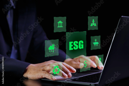 ESG system concept, man using laptop analyzing data for environmental, sustainable and ethical (esg), environmentally friendly, eco earth day ,friendly energy,
