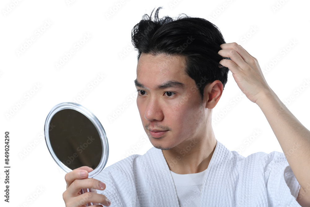 Young Asian man making hair styling after taking shower looking mirror isolated on white background Young Asian man making hair styling after taking shower looking mirror isolated on white background
