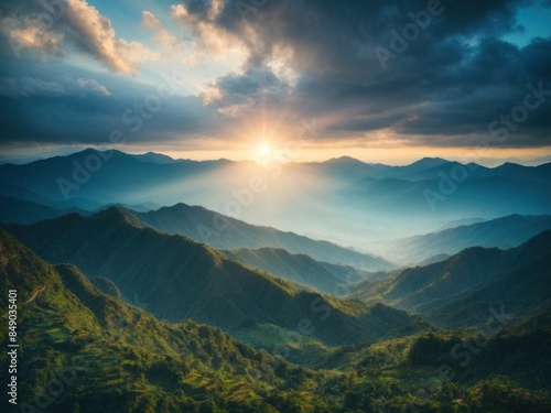 blue color of mountains during sunset with sun rays