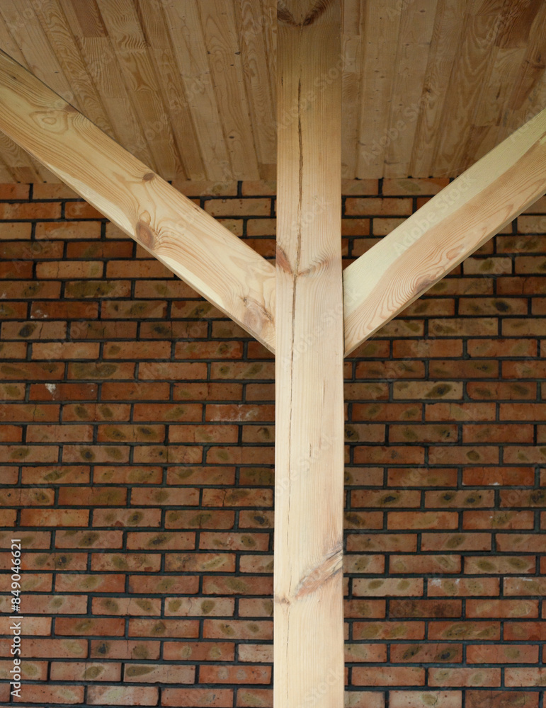 Wooden post with struts.